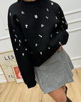 Felpa girocollo in neoprene nera con cabochon - Icona