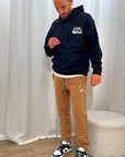 Pantaloni joggers tabacco logo bianco in rilievo