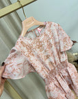 Vestito pitonato rosa con balze
