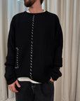 Maglione con mix di intrecci e filo bianco