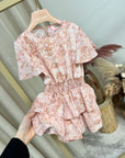 Vestito pitonato rosa con balze
