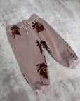 Pantaloni rosa stampa galli