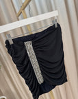 Gonna mini nera drappeggiata con ricamo gioiello