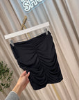 Gonna mini nera drappeggiata con ricamo gioiello