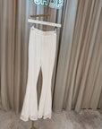Pantaloni in pizzo bianchi a zampa