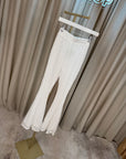 Pantaloni in pizzo bianchi a zampa