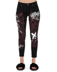 Jeans a sigaretta con logo e graffiti