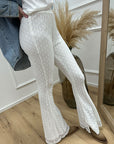 Pantaloni in pizzo bianchi a zampa