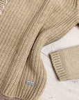 Maglione con mix di intrecci e filo bianco
