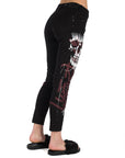 Jeans a sigaretta con logo e graffiti