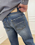 Jeans blu slavati e con strappi