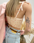 Top pesca fantasia floreale stile corsetto