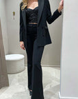 Tailleur nero doppiopetto revers in raso