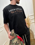 T shirt nera stampa "Love is a feeling"