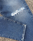 Jeans blu taglio ginocchio