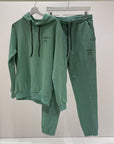 Pantalone menta logo e nastri in contrasto neri