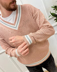 Maglia traforata rosa con scollo a v