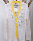 Cardigan bianco con bordi gialli a maglia grande