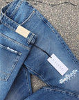 Jeans blu taglio ginocchio